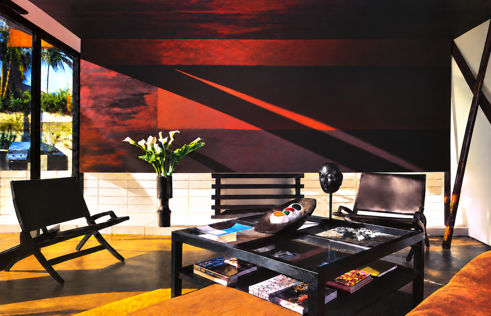 Dramatically sunlit Palm Springs living room with sculptural black furniture and a deep red wall